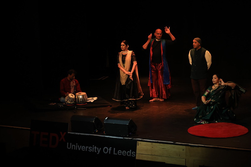 Classical Indian dance performance on stage with live tabla accompaniment