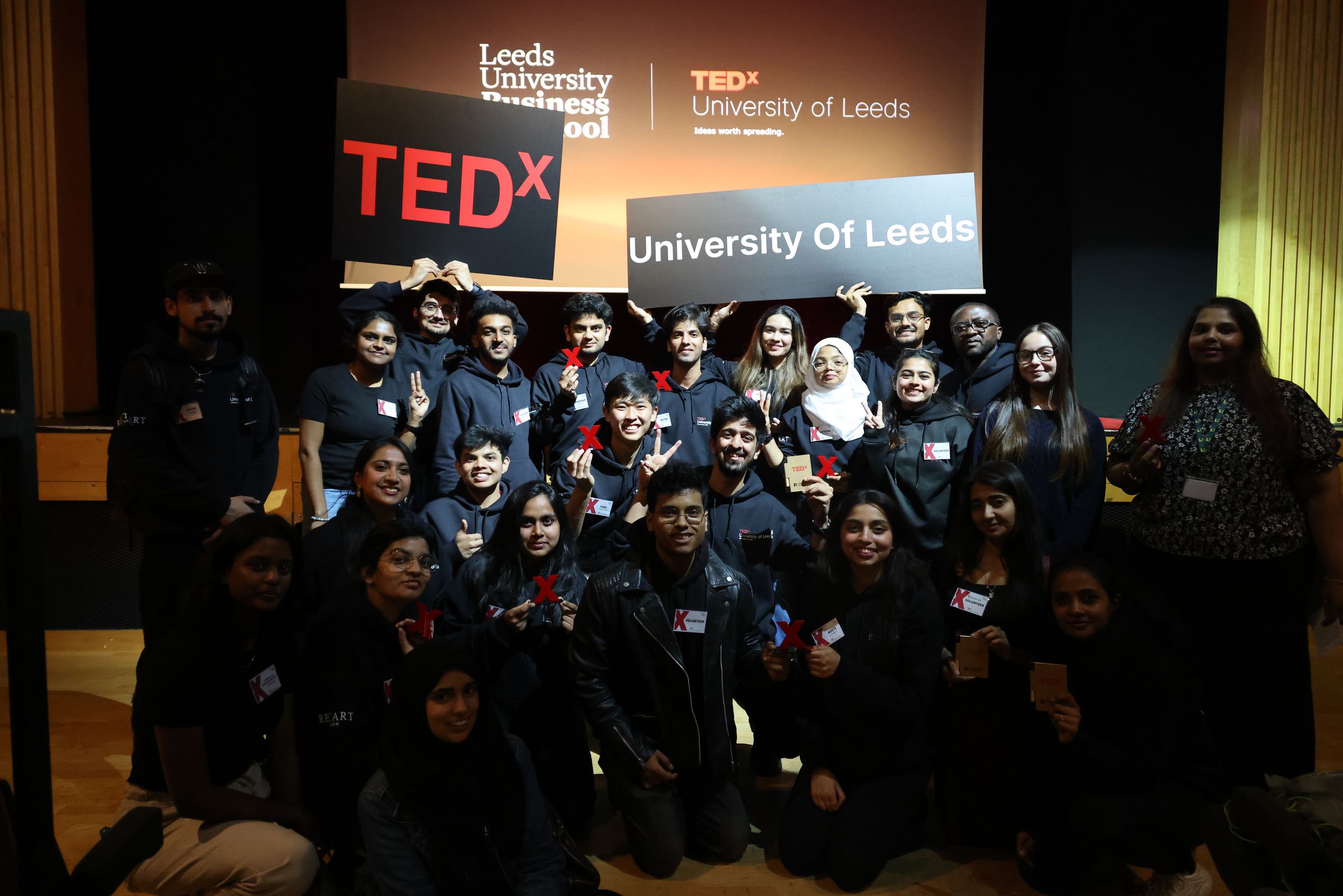 The TEDxUniversityOfLeeds 2026 team gathered for a group photo with the TEDx sign